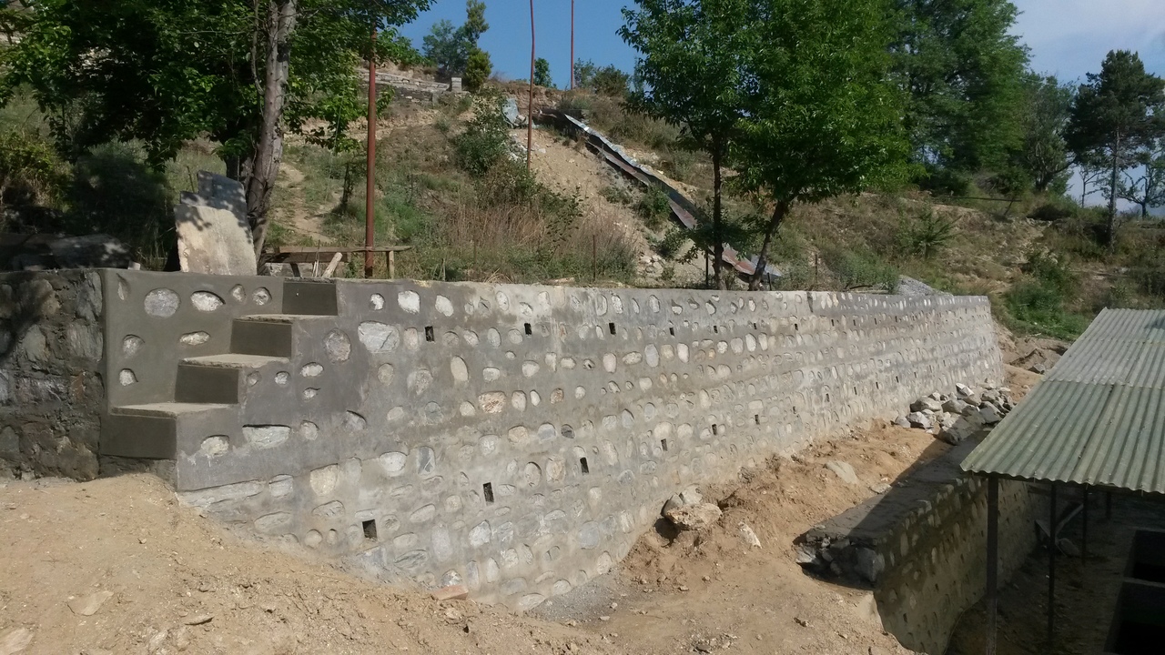 Back retaining wall nearly complete